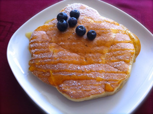 serve blueberry pancakes on a plate