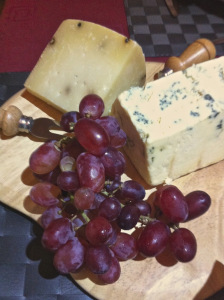 Cheeses and red grapes as second main course 