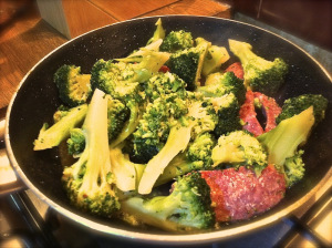 add broccoli to the italian sausages and let to cook together 